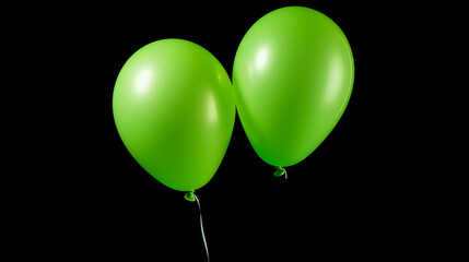 Shiny green balloons flying with ribbon on dark background