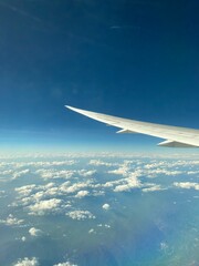 Fototapeta premium Picture on the plan top view sky landscape plane wing window beautiful sky wing of airplane