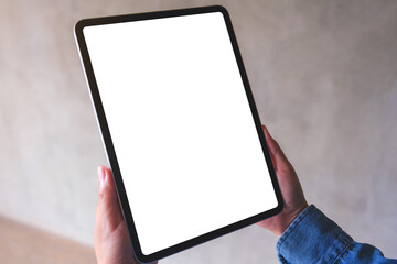 Mockup image of a woman holding digital tablet with blank white desktop screen