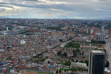 Fototapeta na wymiar Skyline Brilliance: Basking in sunlight, a panoramic view from Colpatria Tower offers a striking perspective of Bogota's vibrant urban landscape. 