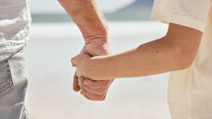 Beach, holding hands or closeup of kid with father walking or bonding together for love or care. Parent, relax or back of man with a child for support, trust or loyalty in nature on family holiday