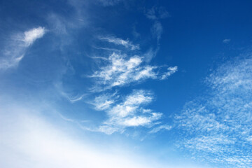 Naklejka na ściany i meble White clouds and blue sky textured background