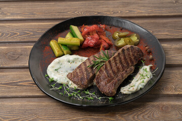 Grilled meat steak on a plate, restaurant menu