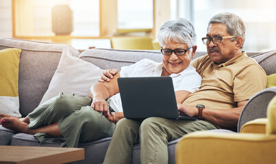 Laptop, relax and senior couple on sofa for watching movies, entertainment and streaming in living room. Retirement, love and happy man and woman on computer for internet, website and film at home