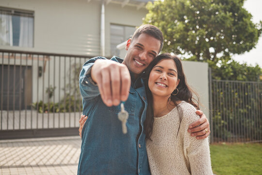 Happy couple, portrait and real estate with keys in property, investment or new home together. Man and woman or homeowners smile for moving in, buying or building loan in asset finance or investing