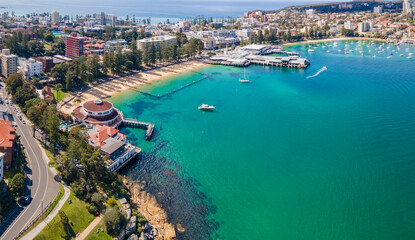 Aerial drone panoramic view of Manly Cove Beach and Manly Wharf on the Northern Beaches of Sydney,...