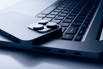 Laptop with smartphone. Close up image.