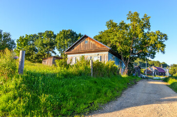 Obraz premium wooden houses in Verkhnii Nergen village (Nanaysky district, Khabarovsk krai, Russia)