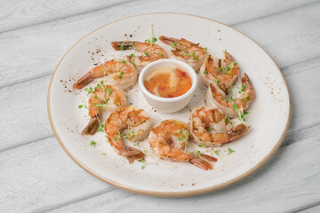 Stir fried shrimp with thai basil on grey plate