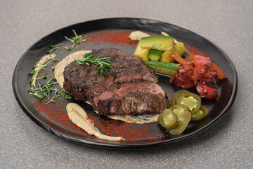 Grilled meat steak on a plate, restaurant menu