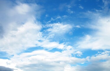 Naklejka na ściany i meble Blue sky background with tiny clouds. Nature background. Blue sky with tiny clouds.
