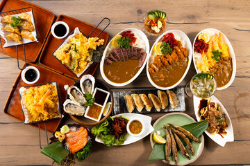 Top view many traditional gourmet japanese food dishes on wood table. Japanese food isolated on wood background