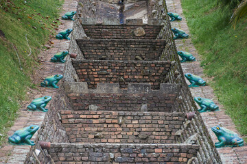 Architectural Elegance Amidst Nature: Decorative architectural elements harmonize with lush plants,...