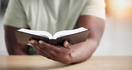 Bible, reading and hands with book and religion study at home for worship and spiritual support....