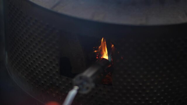 Close-up of lighting wood with a gas burner. Outdoor recreation. Controlled fire.