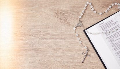 Rosary, table or bible study for faith, studying religion and mindfulness with holy spiritual...