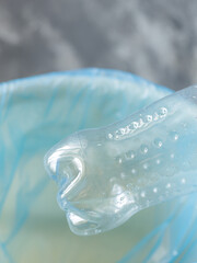 Naklejka premium Environmental Awareness - Discarded Plastic Bottle