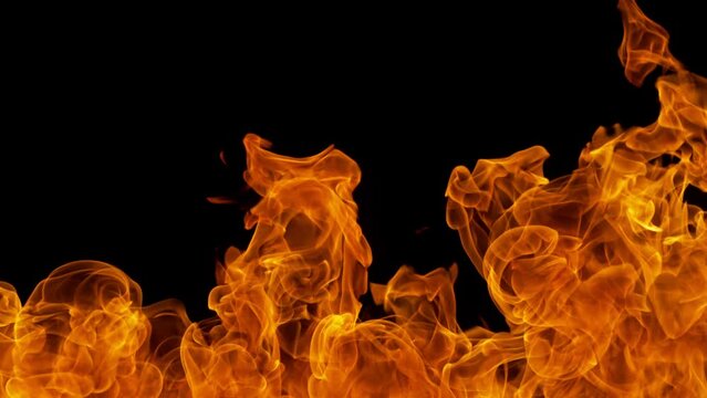 Super Slow Motion Detail Shot of Fire Flame Background Isolated on Black at 1000fps.