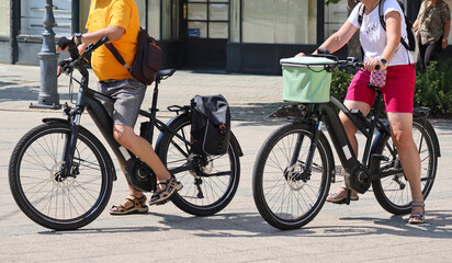 Tourists on bicycles in the city street