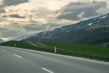 Scenic Mountain Road Landscape. A Stunning Highway Journey through Colorful Nature in Europe. Nature landscape on a beautiful highway. car driving on the highway in spring.