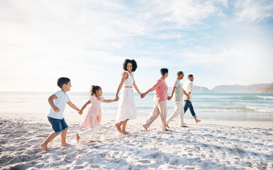 Big family, holding hands and walking at the beach for travel, vacation and adventure in nature. Love, freedom and children with parents and grandparent at sea for fun, journey and bond ocean holiday