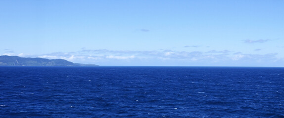 Obraz premium High angle view of coastline and hills calm sea