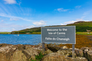 Fototapeta Isle of Canna Welcome Sign to visitors arriving on the island by Ferry.  Both English and Gaelic languages. Small Isles, Inner Hebrides, Scotland.  Horizontal.  Space for copy obraz