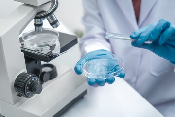 Scientists analyze samples and place them in glassware. Experimenting with liquid chemicals in a glassware lab drinking water research Water quality testing drinking water research