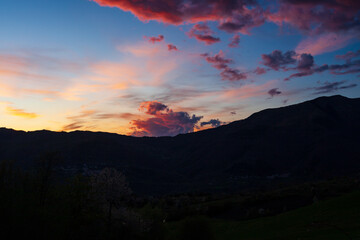 Attractive colorful sunset with cloudy sky in rural area