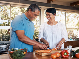 Mature, couple and healthy cooking in kitchen to chop vegetables for salad diet, nutrition and...