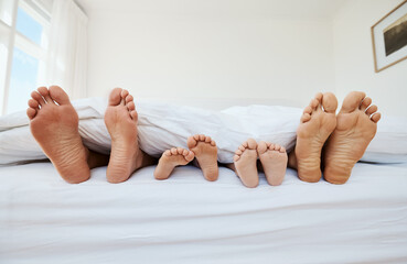 Feet, family and sleep in bedroom in home, relax in peace and rest in blanket in the morning...