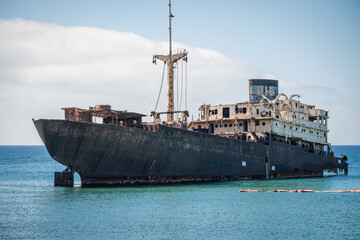 Ship stranded on the coast of Arrecife in Lanzarote, called Telamón. Rusty boat. Stranded ship....