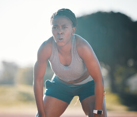 Break, tired and a black woman at a stadium for a workout, training or breathing after cardio....