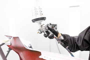 Close up view of painting gun in the workshop