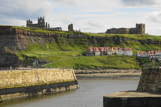 Whitby &ndash; with the 13 century Abbey  and the Church of Saint Mary on the cliff overlooking the town,  North Yorkshire, England - famously linked by Bram Stoker's novel Dracula.
