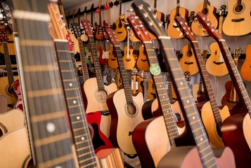 Peel and stick wall murals Music store Many rows of classical guitars in the music shop