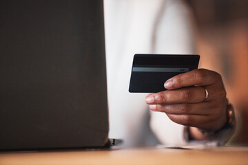 Hand, credit card and laptop, person and e commerce with payment, fintech and account, internet and banking. Closeup, online shopping and finance, budget and customer with subscription and commercial