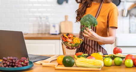 Portrait of beauty body slim healthy asian woman eating vegan food healthy with fresh vegetable...