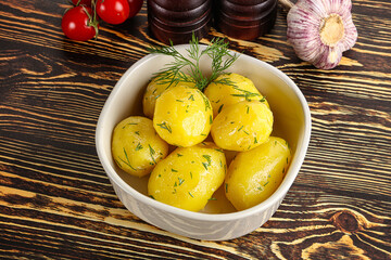 Boiled potato with oil and dill