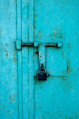 Padlock on metall door. Metal background	