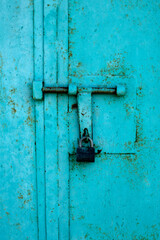 Padlock on metall door. Metal background	