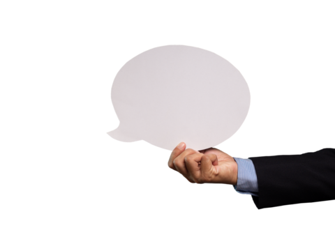 Close-up of a businessman holding a blank white speech bubble while standing on a transparent background