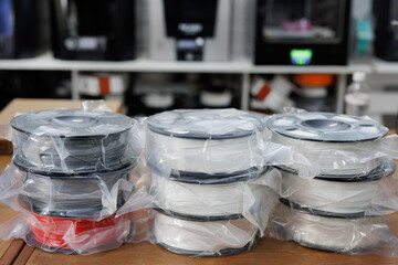 ABS or pla filament coils for 3d printer. New reels in the package - obrazy, fototapety, plakaty
