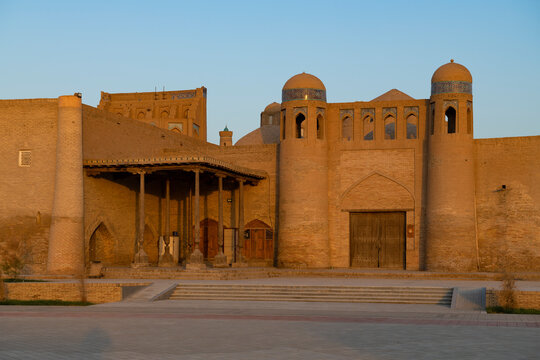 View of the ancient gates of the Alakulli Khan caravanserai on a sunny morning. Itchan-Kala, Khiva