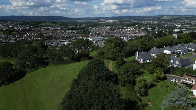 Newton Abbot, South Devon, England: DRONE VIEWS: Wolborough Hill (foreground); the historic market town of Newton Abbot (midground); Dartmoor National Park on the horizon. 
