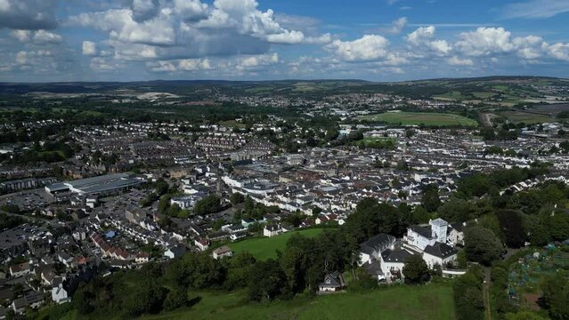 Newton Abbot, South Devon, England: DRONE VIEWS: Wolborough Hill (foreground); the historic market town of Newton Abbot, Newton Abbot racecourse; Dartmoor National Park (horizon). 