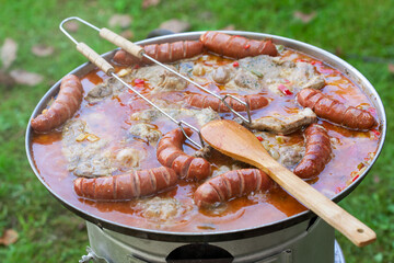Traditional Croatian dish - kotlovina plate cooking