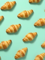 Croissants on pastel blue background taken from above. 