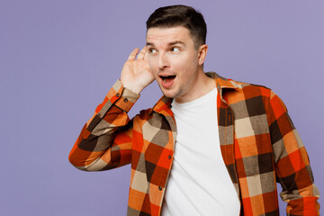 Young curious nosy man he wearing checkered shirt white t-shirt casual clothes try to hear you...