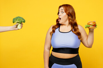 Young shocked astonished chubby overweight plus size big fat fit woman wear blue top warm up train...